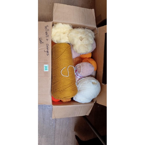 388 - Large box of mainly yellow and orange coloured wool