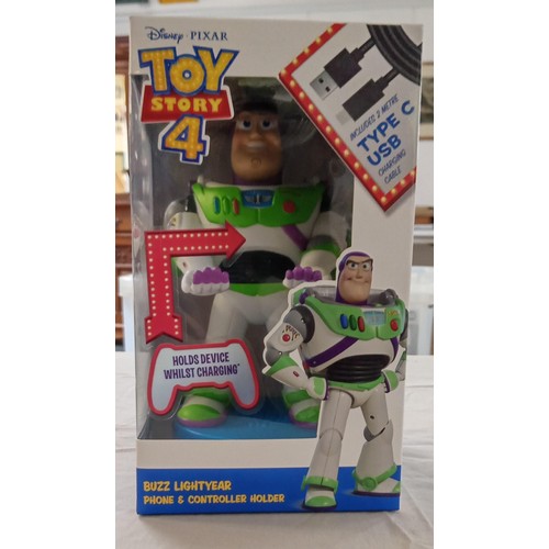 49 - Disney Toy Story 4 Buzz Lightyear phone & game controller holder with USB charger