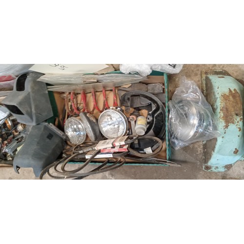 49 - Selection of vehicle spares to include head lights, radio, springs and more