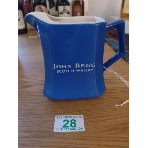 28 - John Begg whisky jug