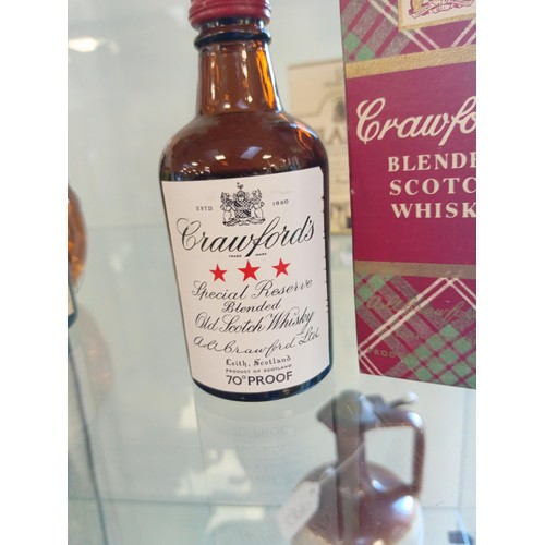 64 - Queen Anne 70 proof, Crawfords 70 proof miniatures both in tartan boxes & Glamis Castle reserve 12 y... 