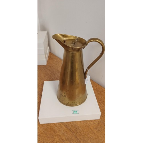 82 - Brass lidded quartz jug