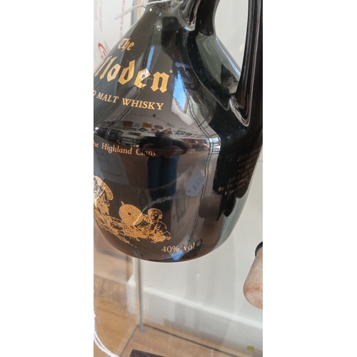 135 - The Culloden Old highland malt whisky flagon spirit of the highland clans in original box sealed wit... 