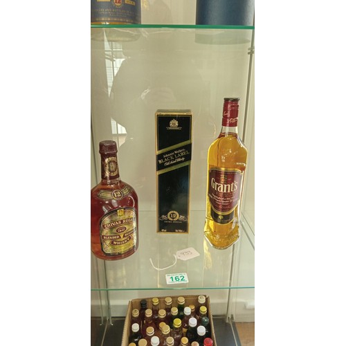 162 - Grants scotch whisky 70cl 40 vol, Johnny Walker Black label 40vol 70cl & Vintage sealed 12 year old ... 