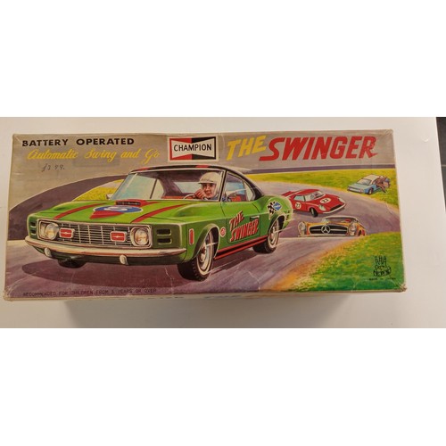 271 - The Swinger made in Japan metal 1960's battery operated car in its original box in immaculate condit... 