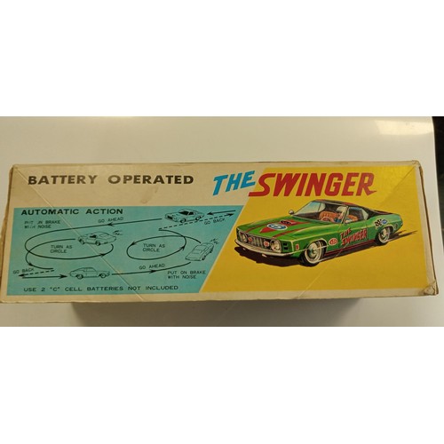 271 - The Swinger made in Japan metal 1960's battery operated car in its original box in immaculate condit... 