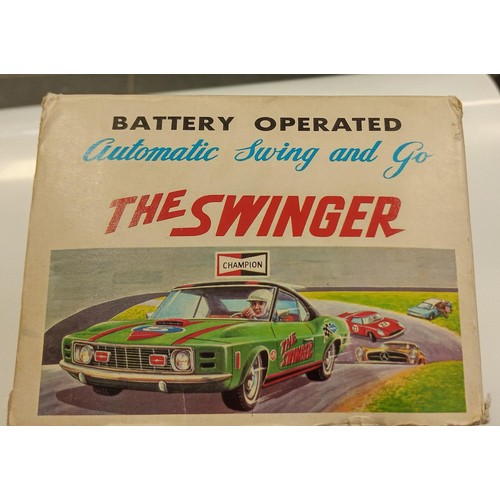 271 - The Swinger made in Japan metal 1960's battery operated car in its original box in immaculate condit... 