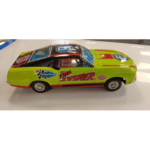 271 - The Swinger made in Japan metal 1960's battery operated car in its original box in immaculate condit... 