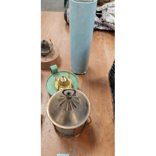 304 - Selection of oil lamps and a vintage carriage lamp