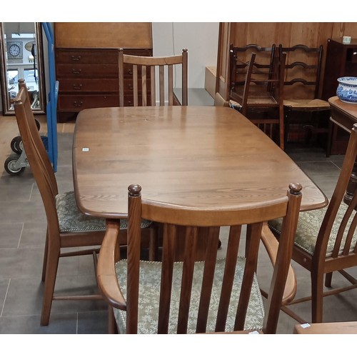 252 - Extending Ercol dining table with 4 Ercol chairs, 2 carvers and 2 normal