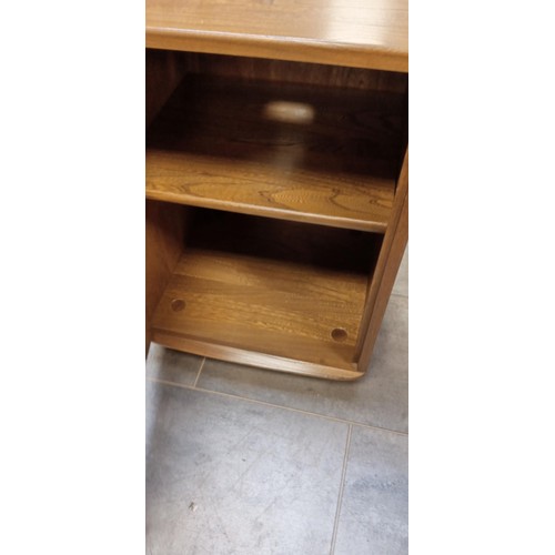 253 - A pair of Ercol Windsor hall/ bedside cabinets