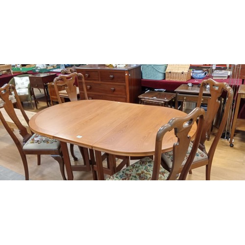 294 - Folding double leafed gate leg dining table plus 4 chairs