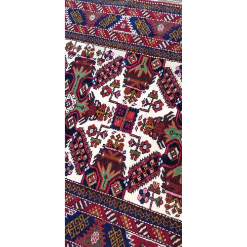 13 - Handmade Azerbaijan rug cream centre field with floral medallions 164cm x 105cm approx. some moth da... 