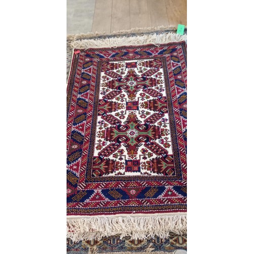 13 - Handmade Azerbaijan rug cream centre field with floral medallions 164cm x 105cm approx. some moth da... 