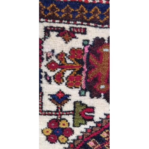 13 - Handmade Azerbaijan rug cream centre field with floral medallions 164cm x 105cm approx. some moth da... 