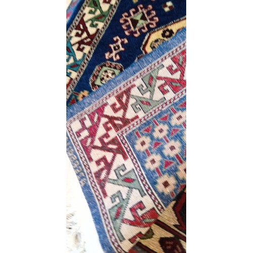 17 - Handmade Azerbaijan rug signed with blue field and cream motifs 130cm x 80cm approx.