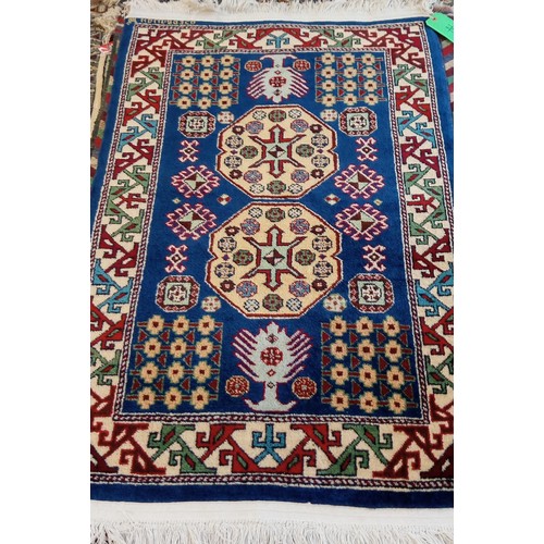 17 - Handmade Azerbaijan rug signed with blue field and cream motifs 130cm x 80cm approx.