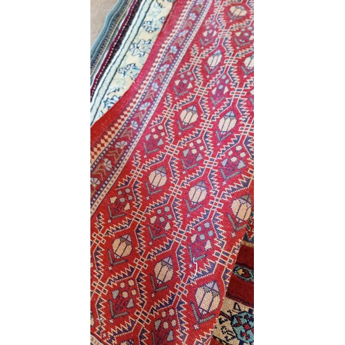 19 - Handmade Azerbaijan rug with red field dated 1990 and signed with geometric design 136cm x 62cm appr... 