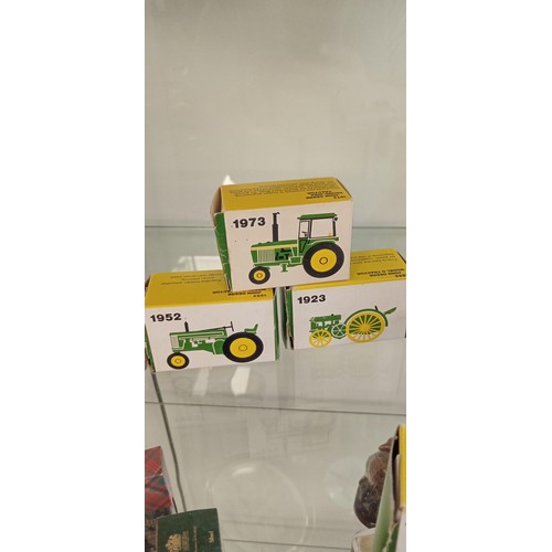 32 - 8 John Deere made in USA miniature tractors mainly in boxes