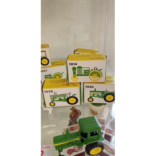 32 - 8 John Deere made in USA miniature tractors mainly in boxes