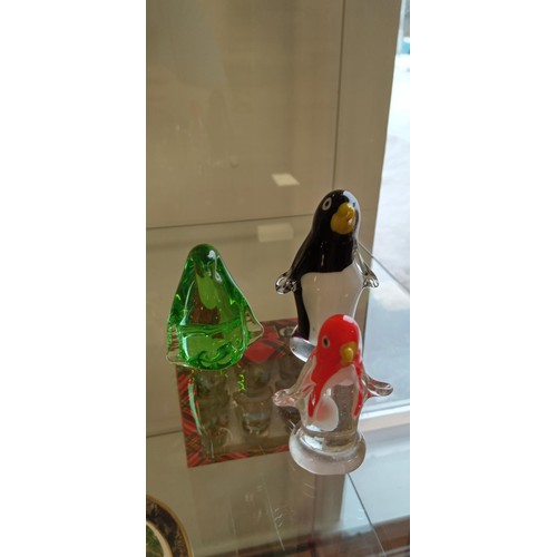 35 - 4 glass penguins, larger one has nibble to its tail