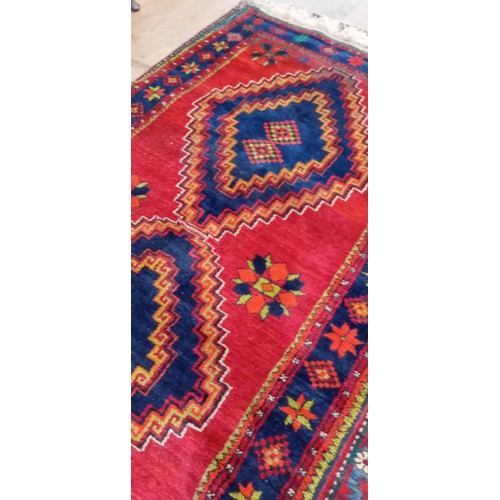 40 - Handmade Azerbaijan rug dated 1955 red field with 2 medallions with a nice border 245cm x 140cm appr... 