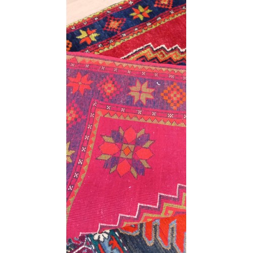 40 - Handmade Azerbaijan rug dated 1955 red field with 2 medallions with a nice border 245cm x 140cm appr... 