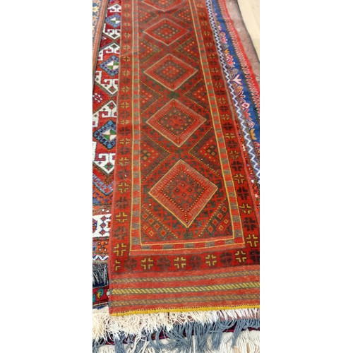 60 - Hand knotted flat weave runner predominately red and green