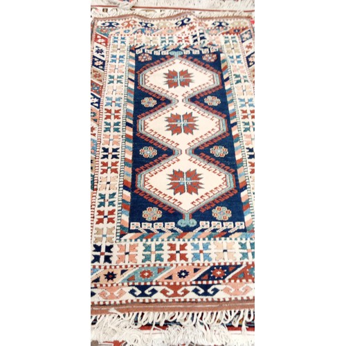 202 - Handmade Azerbaijan rug cream field Kazak with multi coloured borders 175cm x 1m approx.