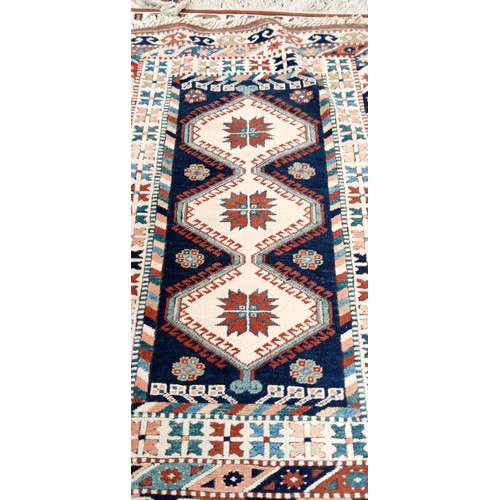 202 - Handmade Azerbaijan rug cream field Kazak with multi coloured borders 175cm x 1m approx.