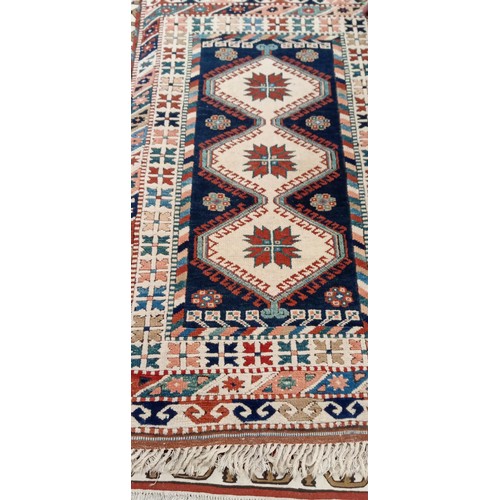 202 - Handmade Azerbaijan rug cream field Kazak with multi coloured borders 175cm x 1m approx.