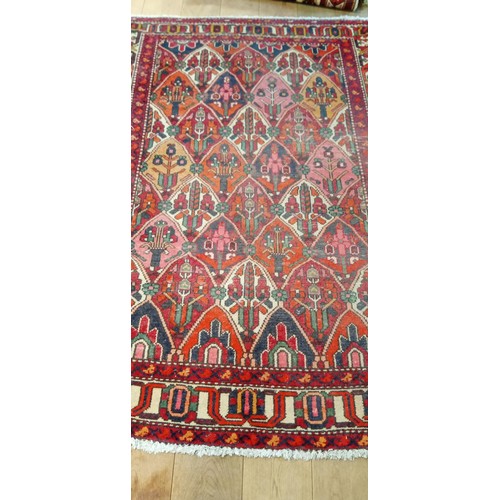 212 - Handmade rug well worn multi coloured beige and reds 190cm x 143cm approx.