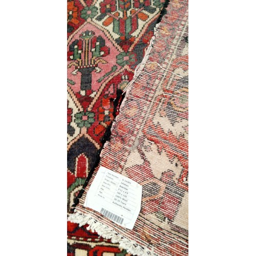 212 - Handmade rug well worn multi coloured beige and reds 190cm x 143cm approx.