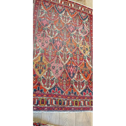 212 - Handmade rug well worn multi coloured beige and reds 190cm x 143cm approx.