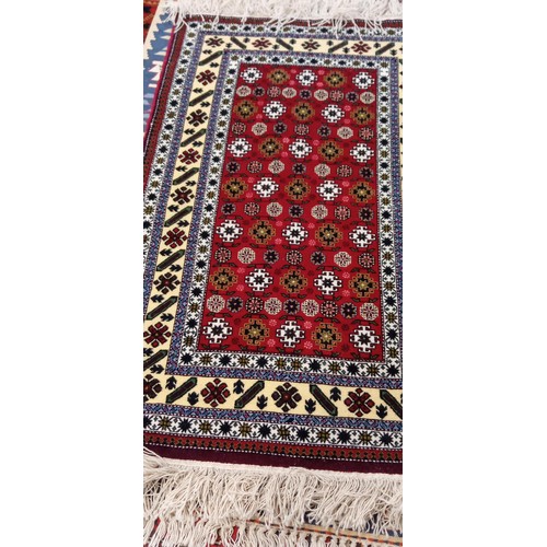 215 - Handmade Azerbaijan rug named & signed red field with multiple borders 170cm x 1m approx.