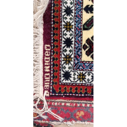 215 - Handmade Azerbaijan rug named & signed red field with multiple borders 170cm x 1m approx.