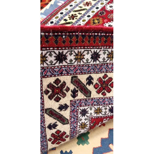 215 - Handmade Azerbaijan rug named & signed red field with multiple borders 170cm x 1m approx.