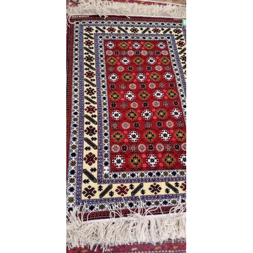 215 - Handmade Azerbaijan rug named & signed red field with multiple borders 170cm x 1m approx.