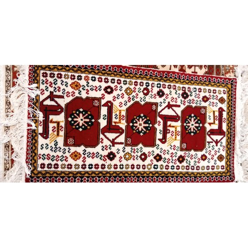 221 - Handmade Azerbaijan rug beige field with animal and geometric motifs 108cm x 53cm approx.