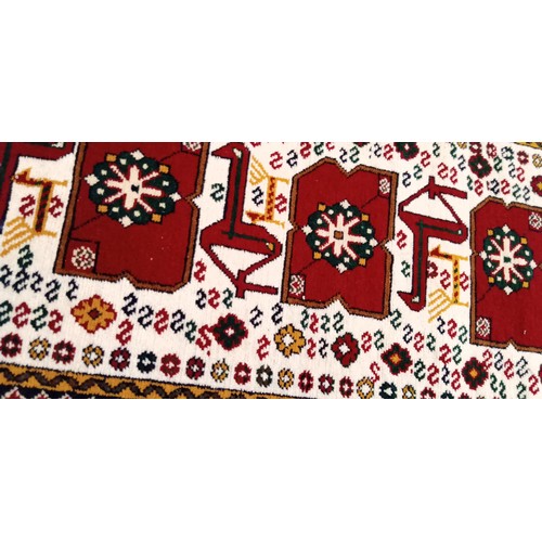 221 - Handmade Azerbaijan rug beige field with animal and geometric motifs 108cm x 53cm approx.