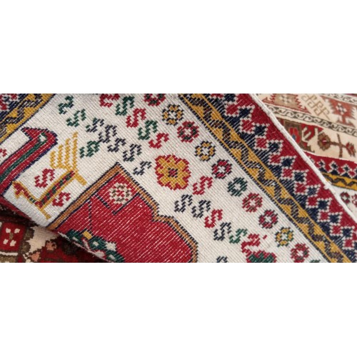 221 - Handmade Azerbaijan rug beige field with animal and geometric motifs 108cm x 53cm approx.