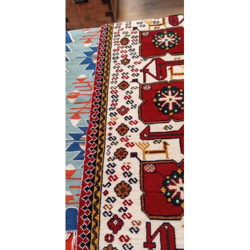 224 - 2 Handmade Azerbaijan rugs 1 Beige field with animal motifs 105cm x 53cm approx. and flat weave kili... 