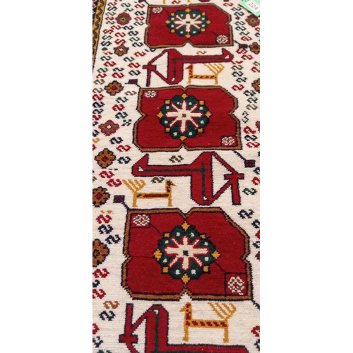 224 - 2 Handmade Azerbaijan rugs 1 Beige field with animal motifs 105cm x 53cm approx. and flat weave kili... 