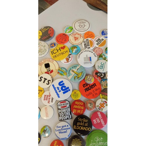 24 - Selection of vintage badges on places and slogans mainly