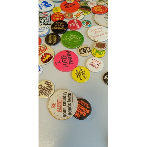 24 - Selection of vintage badges on places and slogans mainly