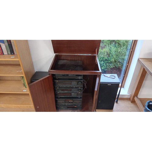 18 - Sony multi stacker music system with speakers and cabinet