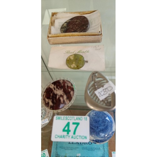 47 - Selection of Scottish brooches and polished stone