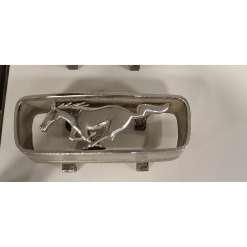 141 - 2 Ford Mustang grill horse emblems