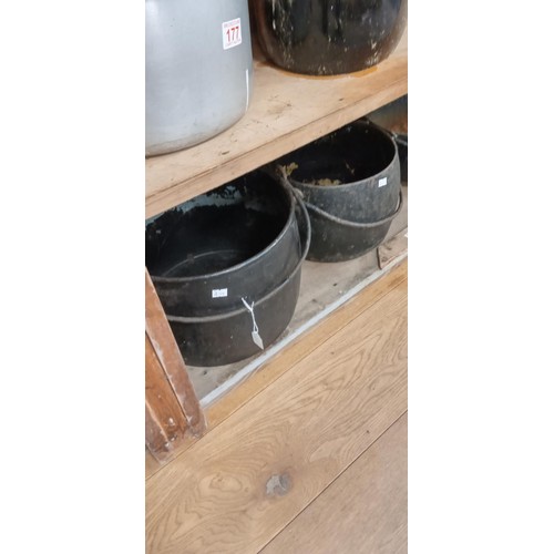 181 - 4 Cast iron cauldrons suitable for the garden as all have bases drilled through