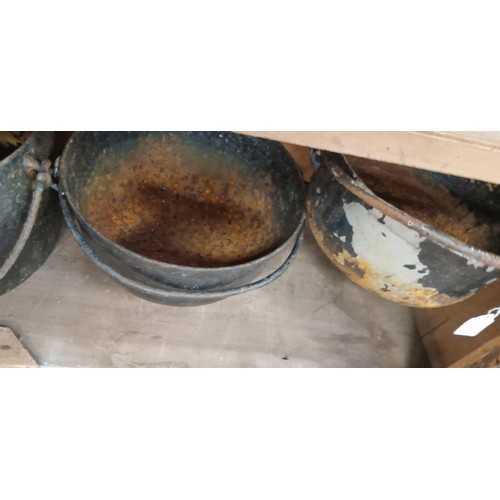 181 - 4 Cast iron cauldrons suitable for the garden as all have bases drilled through